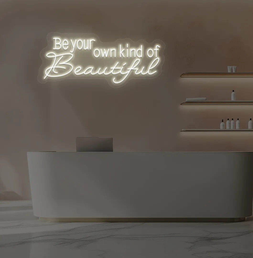 Warm white "be your own kind of beautiful" LED neon sign for beauty studio setup.