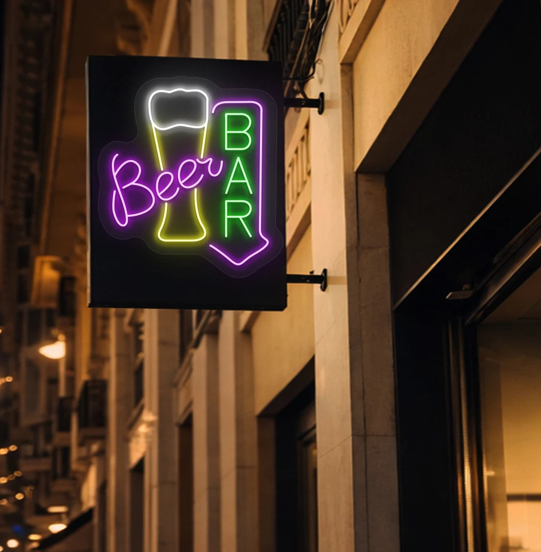 Trendy beer bar arrow neon sign in green mounted on wall.