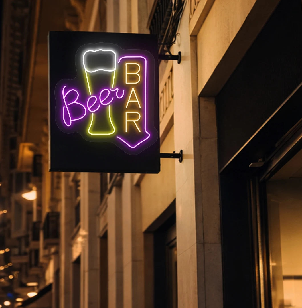 Trendy beer bar arrow neon sign in orange mounted on wall.