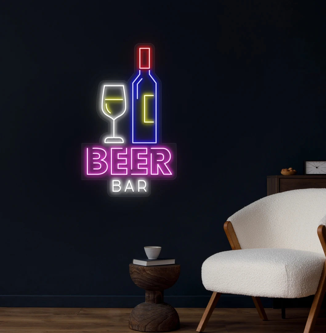 Modern wall decor with beer bar bottle neon sign glowing pink.