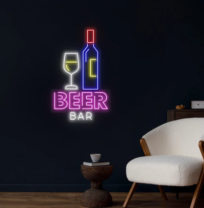 Modern wall decor with beer bar bottle neon sign glowing pink.