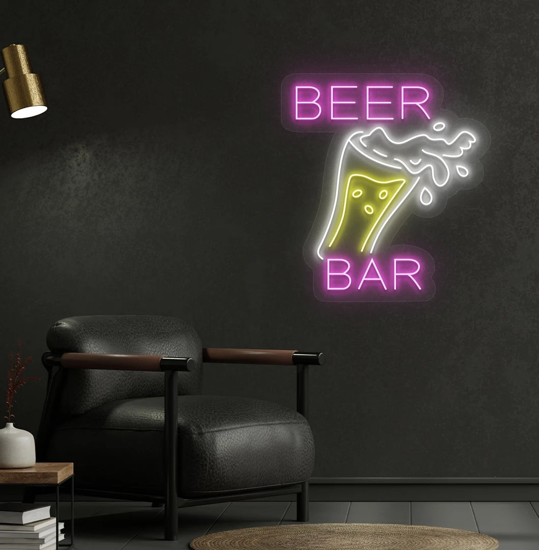 Image of a bright beer bar with glass neon sign mounted on a bar wall in pink color.