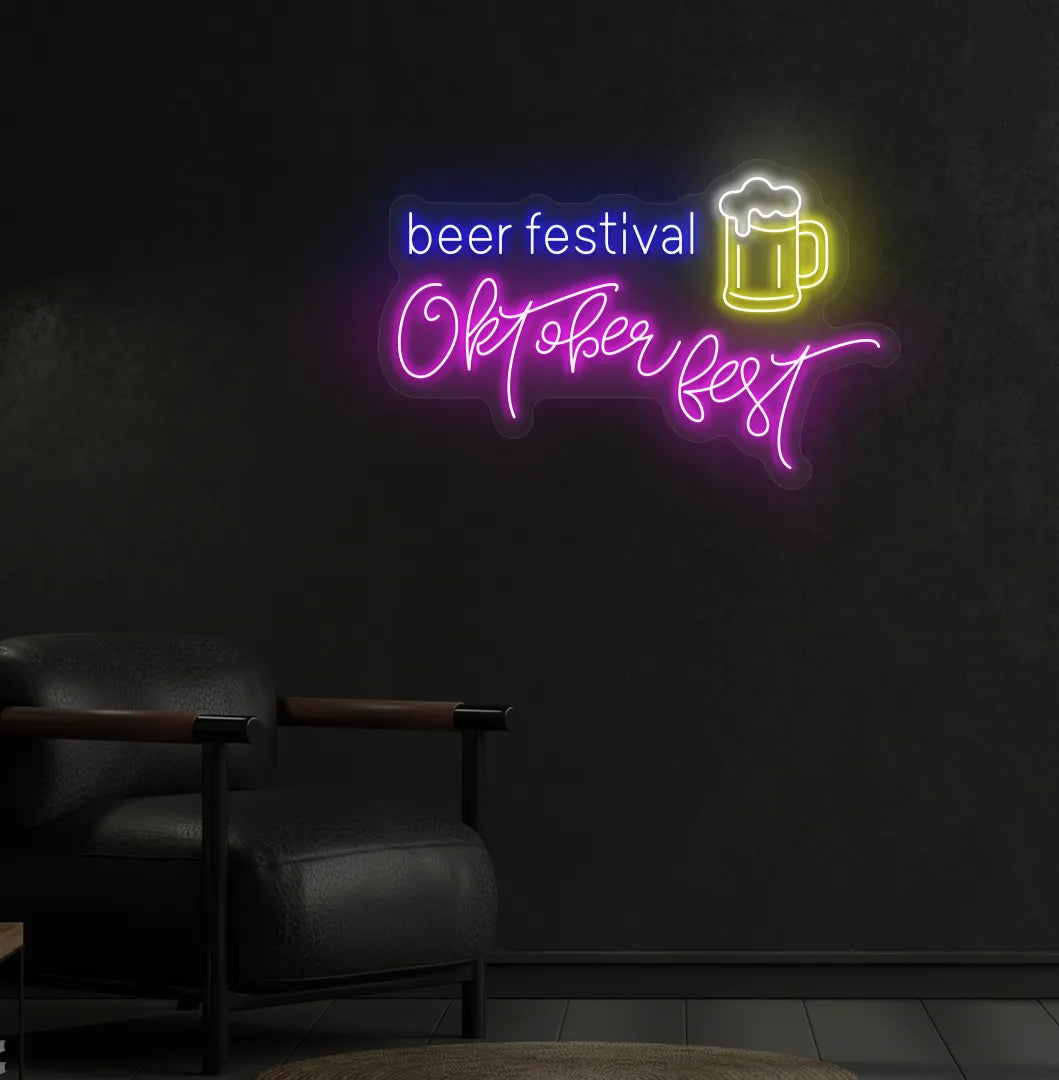 Beer Festival Oktoberfest Neon Sign illuminated in pink and mounted on a wall.