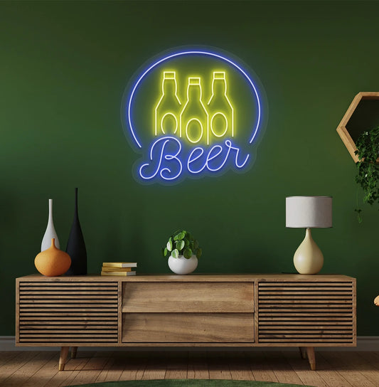 Modern wall decor with beer text and bottles neon sign glowing blue.