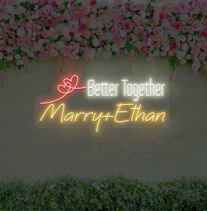 Personalized Better Together neon sign with custom names mounted on modern wedding backdrop wall in orange color.