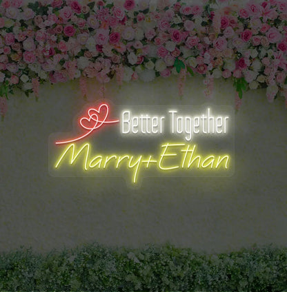 Personalized Better Together neon sign with custom names mounted on modern wedding backdrop wall in yellow color.