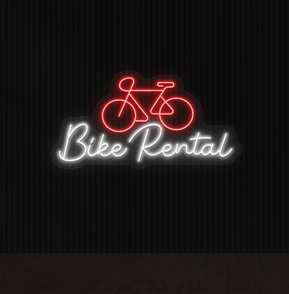 Image of a bike rental neon sign with bicycle icon mounted on wall in red color.