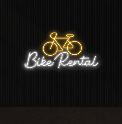 Bright orange LED bike rental neon sign with cycle icon glowing on wall.