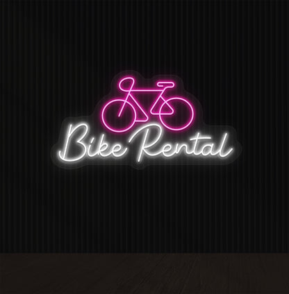 Image of a bike rental neon sign with bicycle icon mounted on wall in pink color.