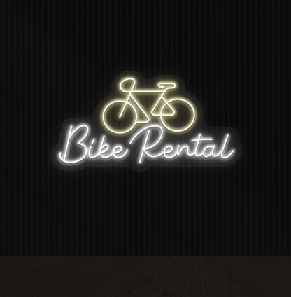 Bright warm white LED bike rental neon sign with cycle icon glowing on wall.