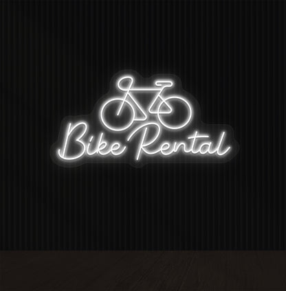Image of a bike rental neon sign with bicycle icon mounted on wall in white color.