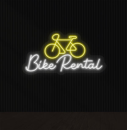 Bright yellow LED bike rental neon sign with cycle icon glowing on wall.