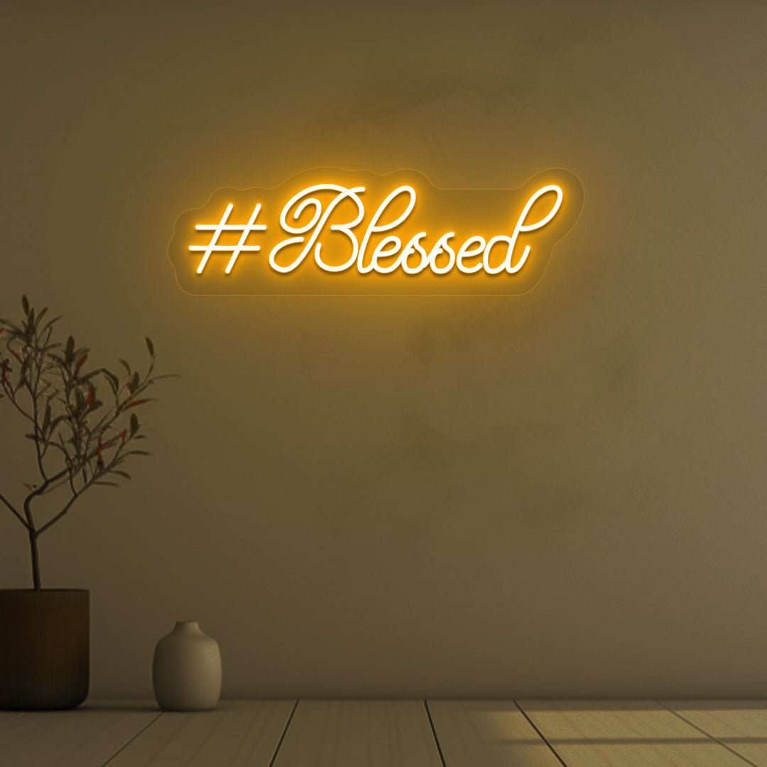 Stylish blessed orange LED neon sign mounted on wall. 