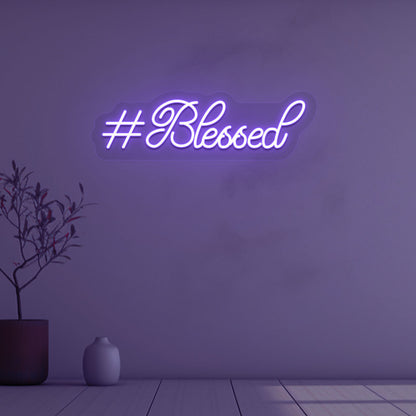 Stylish blessed purple LED neon sign mounted on wall. 