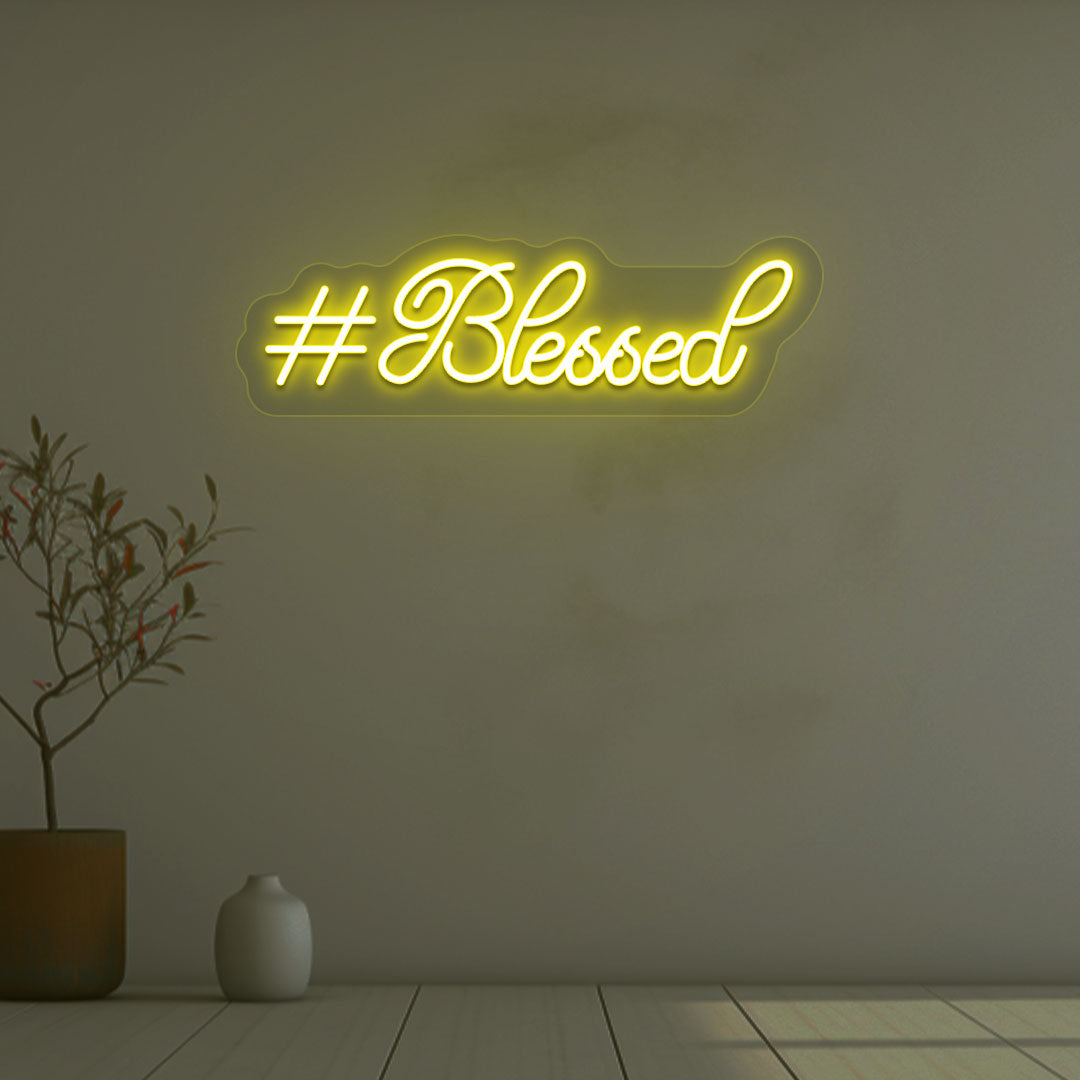 Image of a blessed LED neon sign on wall decor in yellow color.