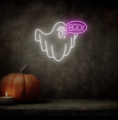 Pink LED Boo Ghost neon sign mounted on a Halloween themed wall.