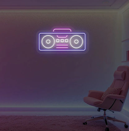 Image of a boombox neon sign in blue color mounted on gaming room wall.