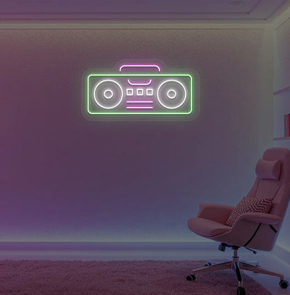 Stylish boombox LED neon sign in green mounted on gaming room wall.