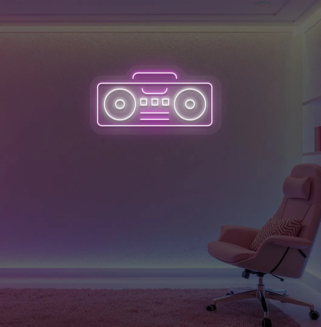 Stylish boombox LED neon sign in pink mounted on gaming room wall.