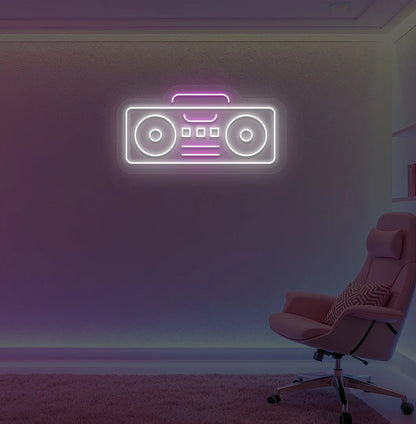 Image of a boombox neon sign in white color mounted on gaming room wall.