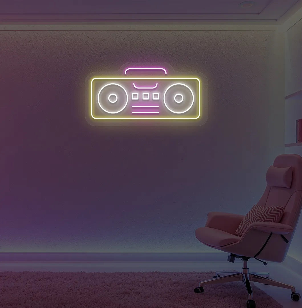Stylish boombox LED neon sign in yellow mounted on gaming room wall.