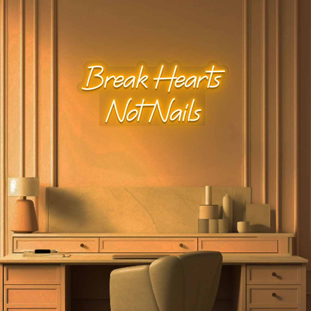 Image of a break hearts, not nails neon sign glowing on a salon wall in orange color.