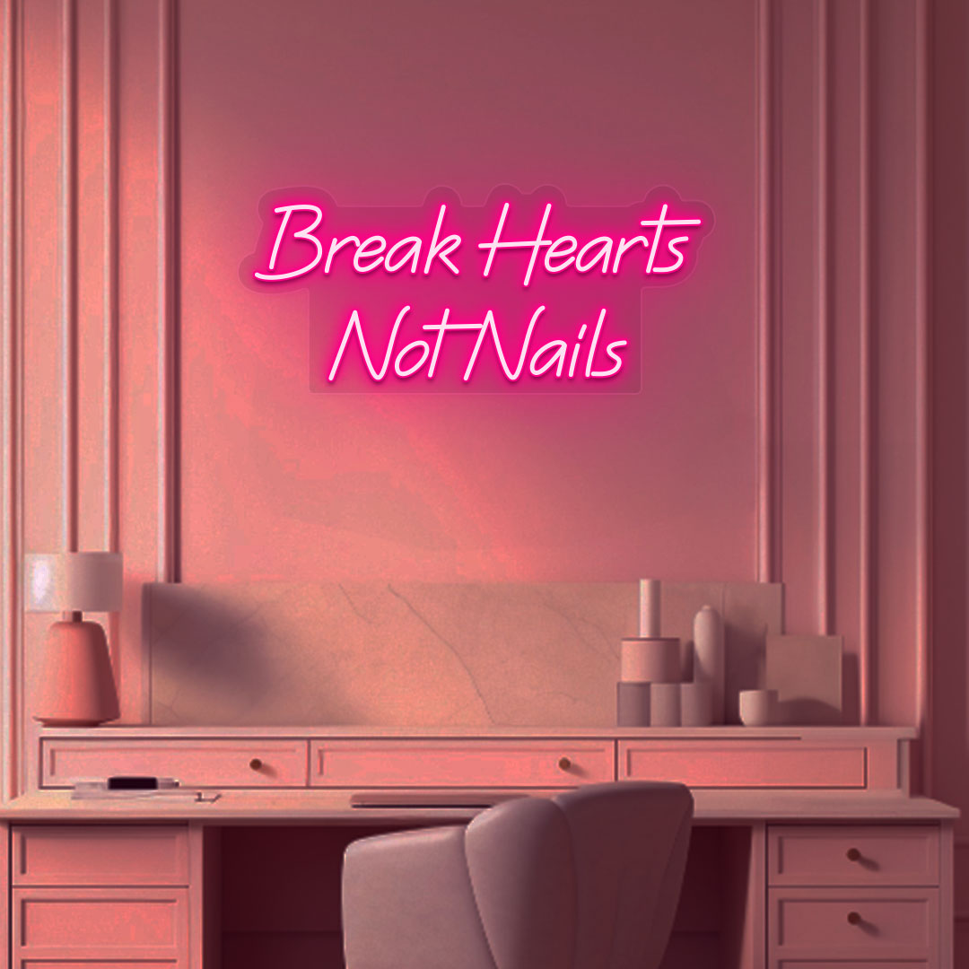 Beauty studio wall with break hearts, not nails neon sign glowing pink.