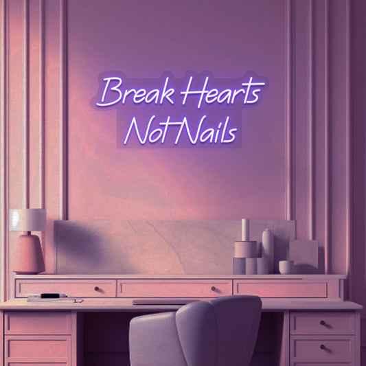 Image of a break hearts, not nails neon sign glowing on a salon wall in purple color.