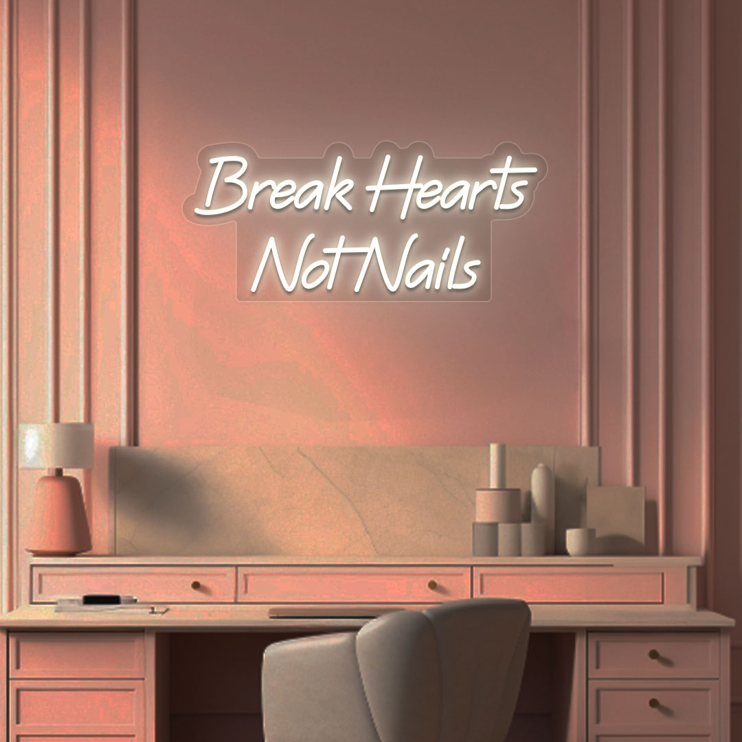 Image of a break hearts, not nails neon sign glowing on a salon wall in warm white color.