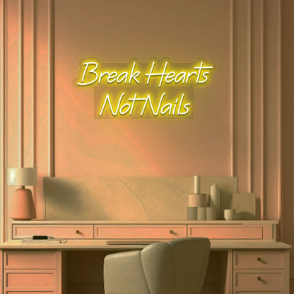 Beauty studio wall with break hearts, not nails neon sign glowing yellow.
