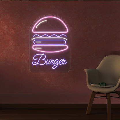 A stylish pink and purple LED burger neon sign is mounted on the restaurant wall.