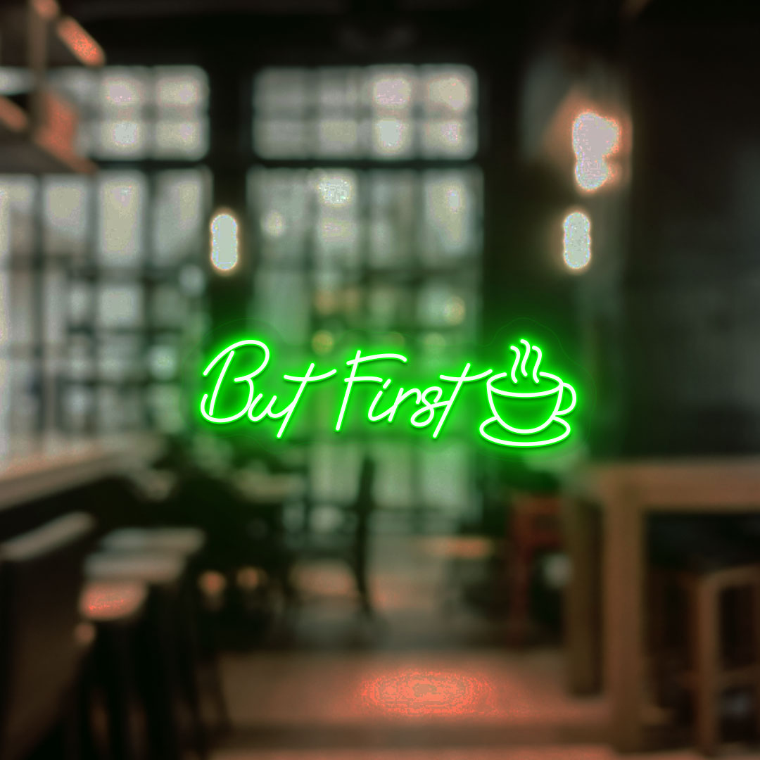 Coffee shop entrance, but first a neon sign and cup icon glowing in green.