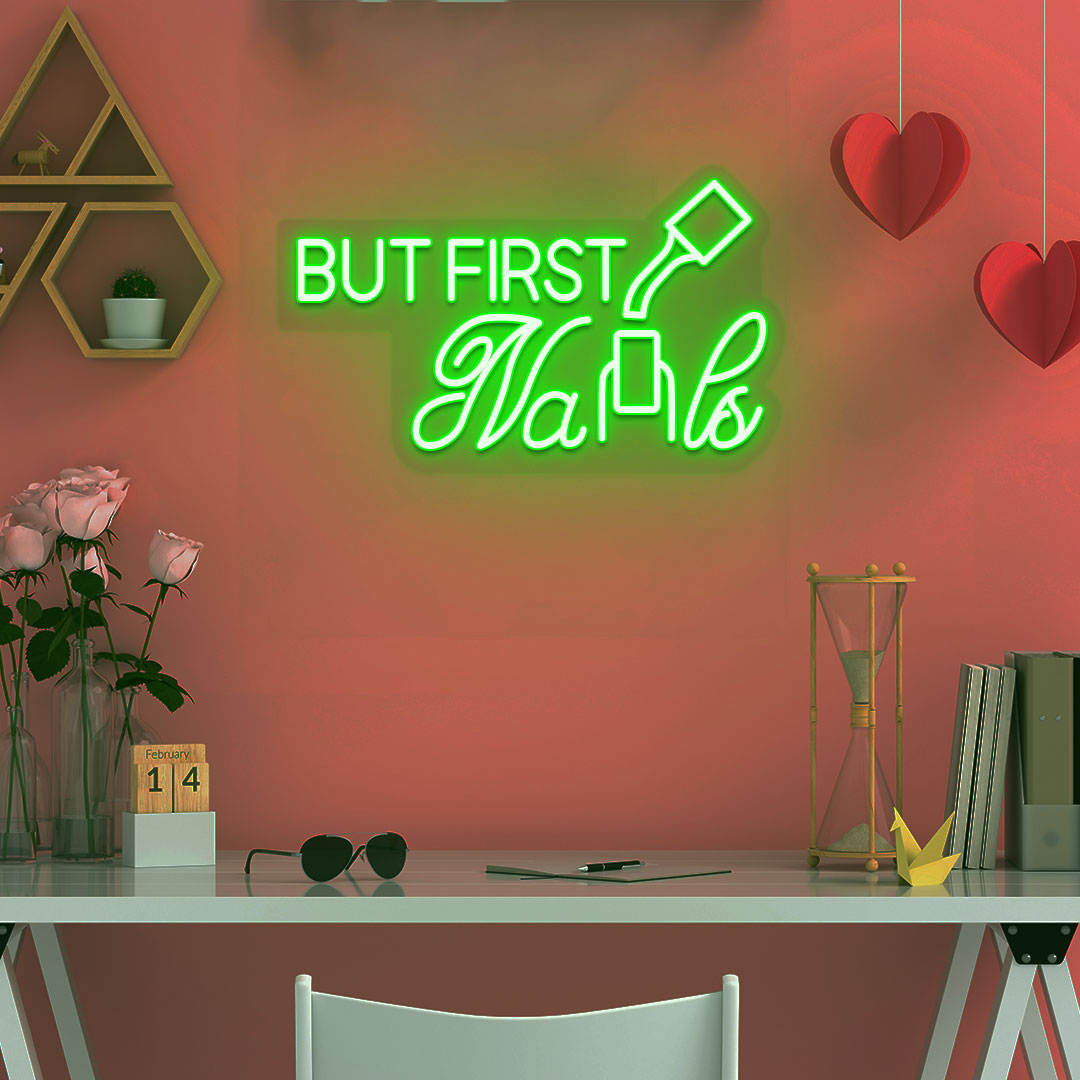 Stylish green LED "But First Nails" neon sign mounted on salon wall. Perfect for nail salons, beauty studios, home nail art spaces, and salon storefront displays.