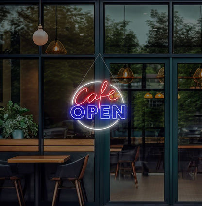Image of a cafe's open neon sign glowing on the cafe glass door in blue.