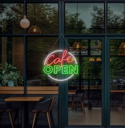 Modern cafe open neon sign glowing green on cafe door.
