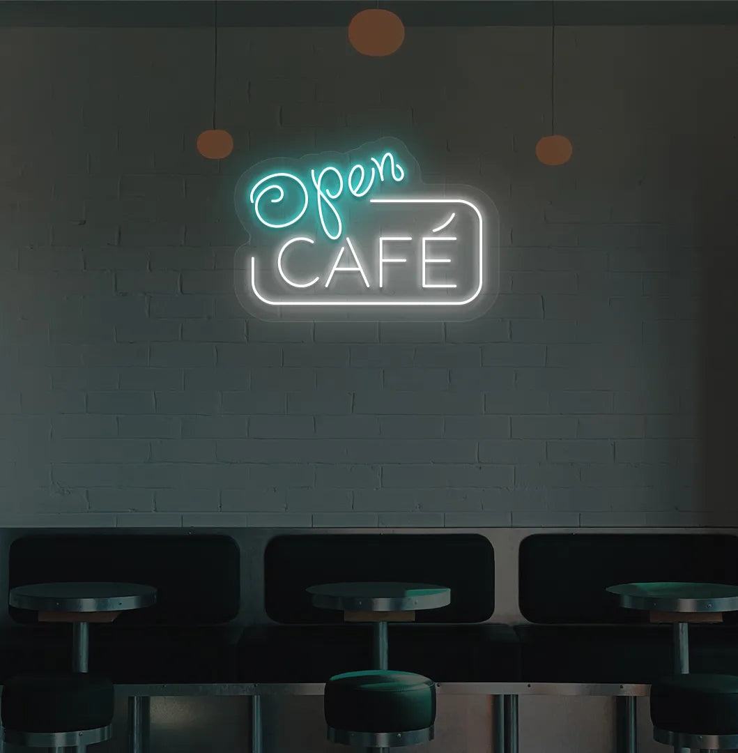 Image of a cafe wall with ice blue cafe open neon sign glowing brightly.