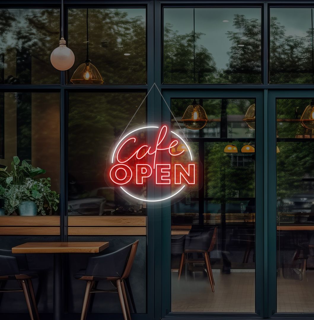 Image of a cafe's open neon sign glowing on the cafe glass door in red.