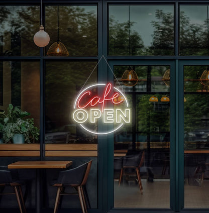 Modern cafe open neon sign glowing warm white on cafe door.