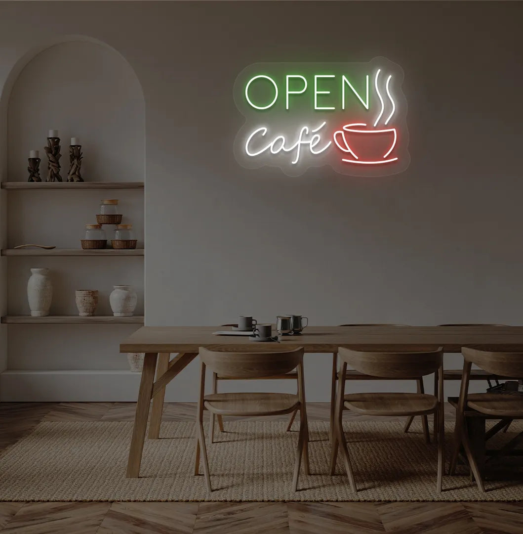 Stylish cafe open with coffee cup neon light in green mounted on cafe wall.