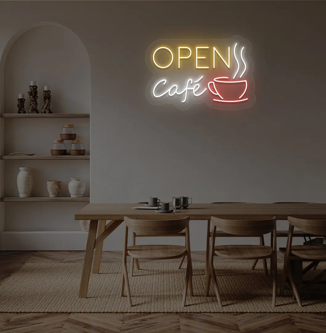 Stylish cafe open with coffee cup neon light in orange mounted on cafe wall.