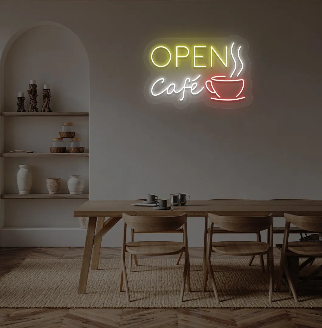 Stylish cafe open with coffee cup neon light in yellow mounted on cafe wall.