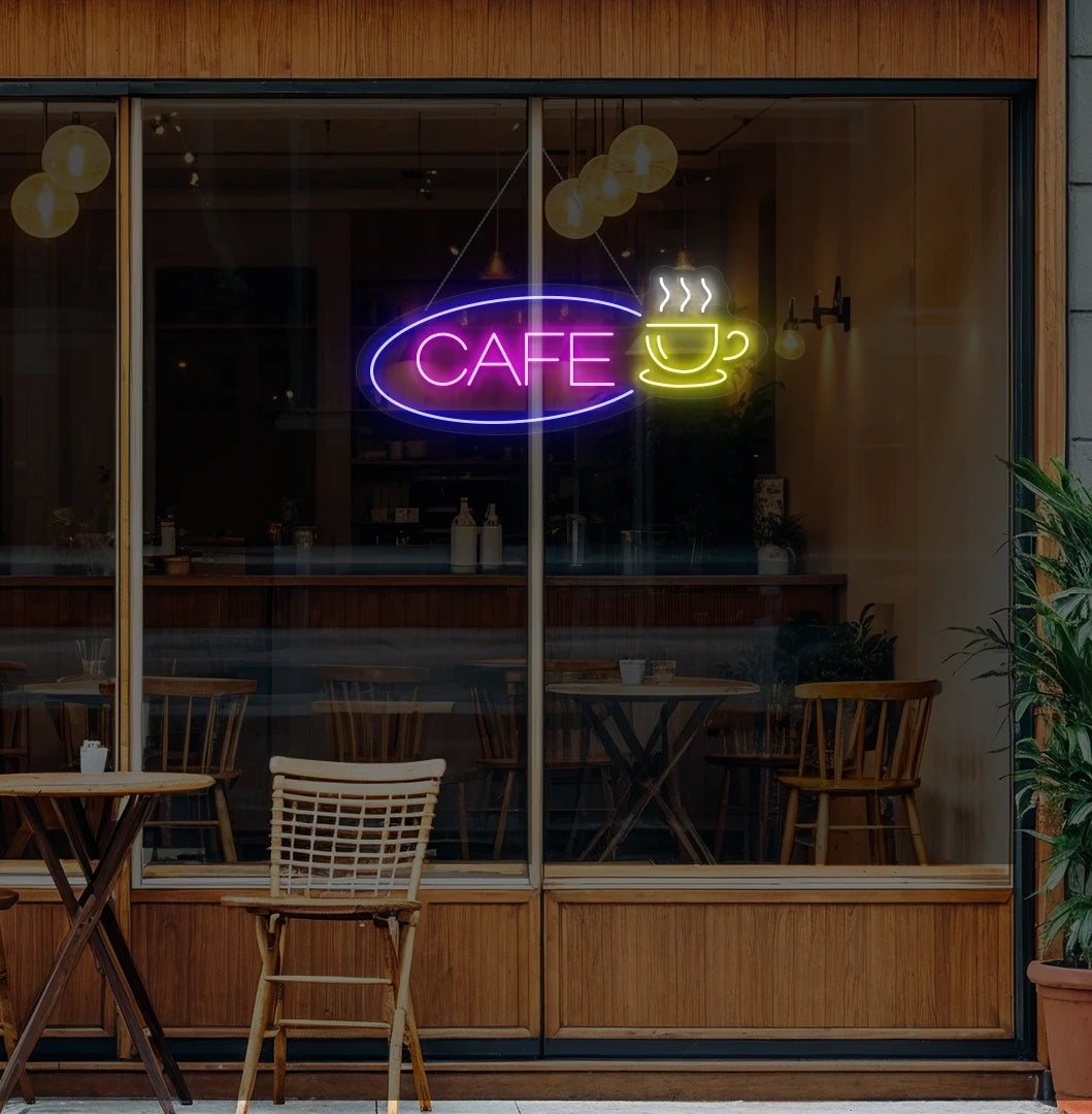 Modern wall decor with cafe cup neon sign glowing pink.