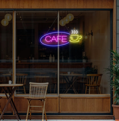 Modern wall decor with cafe cup neon sign glowing pink.