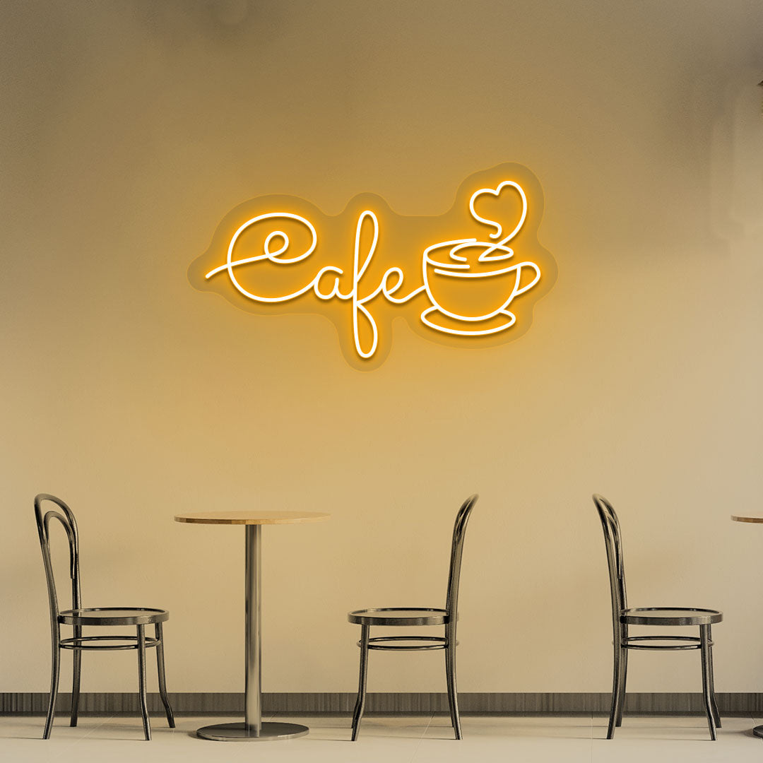 Coffee shop wall decor with orange LED cafe neon sign with mug.