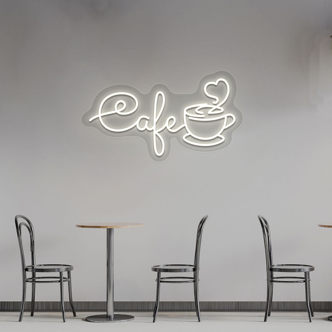 Image of a cafe with a mug LED neon sign hanging on an aesthetic cafe wall in warm white color.