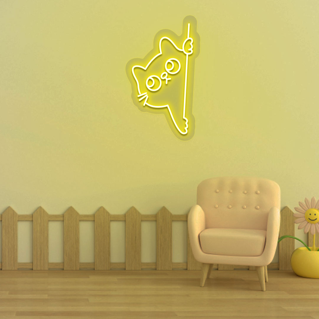 Image of a peeking cat LED neon sign hanging on a kid's bedroom wall in yellow color.