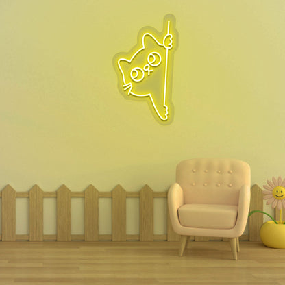 Image of a peeking cat LED neon sign hanging on a kid's bedroom wall in yellow color.