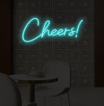 Image of a "cheers" LED neon sign mounted on a modern bar wall in ice blue color.