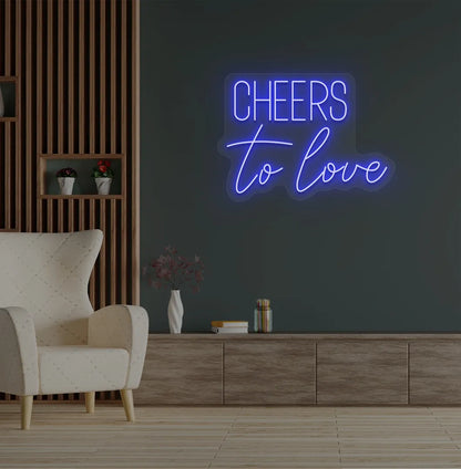Modern wedding backdrop featuring Cheers to Love blue neon sign.
