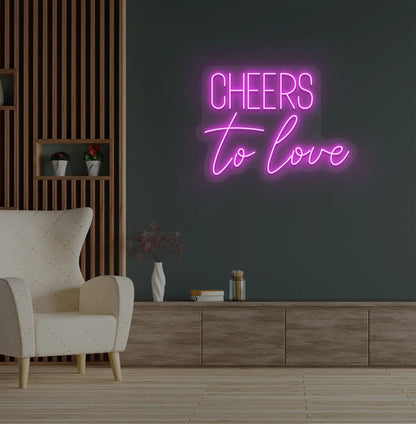 Modern wedding backdrop featuring Cheers to Love pink neon sign.
